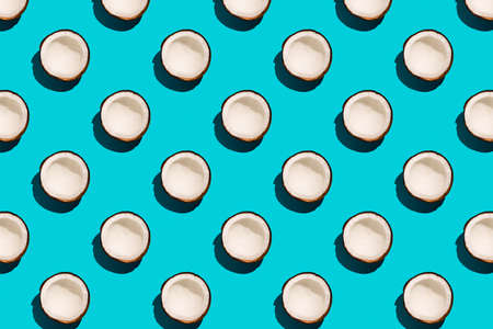 Coconut pattern on pastel blue background. Sunny summer concept. Flat layの写真素材