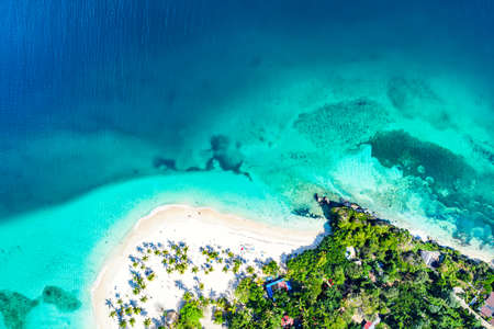 Vacation background. Aerial drone view of beautiful caribbean tropical island Cayo Levantado beach...