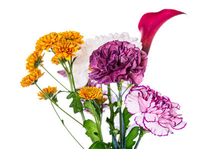 Beautiful spring bouquet with carnation flowers and chrysanthemums close up isolated on white background.の写真素材