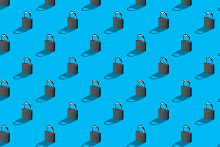 Security concept. Metal padlocks on bright blue background abstract pattern.の写真素材