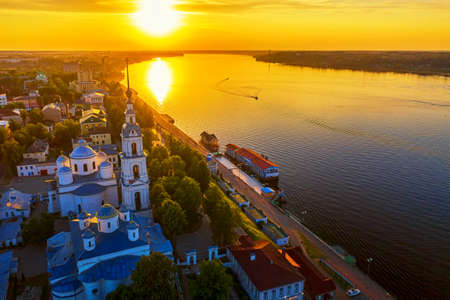 Aerial drone view of Kineshma ancient city with Volga river in Ivanovo region, Russia. Summer sunny day sunset.の写真素材