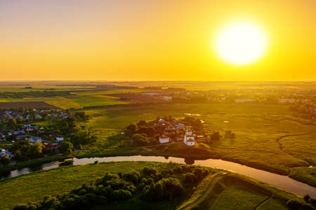 Aerial drone view of the church of Elijah the Prophet at the Kamenka river, Russia. Summer sunny day sunset.の写真素材