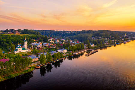 Aerial drone view of ancient russian town Ples on the Volga river with colorful sunset.の写真素材