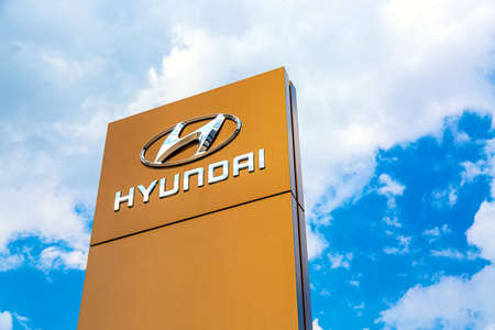 Moscow, Russia - August, 2021: Hyundai automobile dealership Sign against blue sky. Hyundai Kia is a South Korean manufacturer of automobiles and commercial vehiclesのeditorial素材