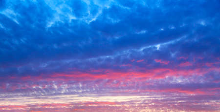 Beautiful sunset sky abstract background. Sky with red pink clouds. Nature backgroundの写真素材