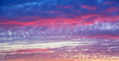 Beautiful sunset sky abstract background. Sky with red pink clouds. Nature backgroundの写真素材