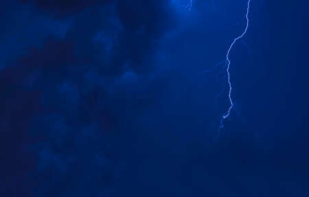 spectacular thunderbolt and tree silhouettes in summer