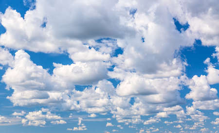 Blue sky background with clouds. Can be used as a natural backgroundの写真素材