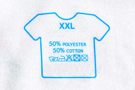 Laundry care washing instructions label on T-shirt.の写真素材