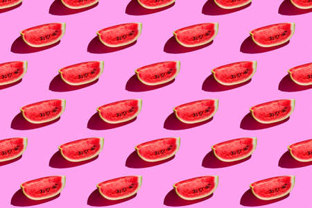 Top view of watermelon slices on pink background. Watermelon colorful pattern.