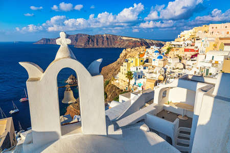 Oia village with famous white houses and blue churches on Santorini island, Aegean sea, Greeceの写真素材