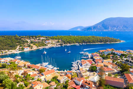 Aerial drone view of Fiscardo village port with luxury boats and yachts on Kefalonia island, Greeceのeditorial素材