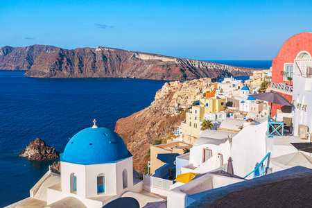 Oia village with famous white houses and blue churches on Santorini island, Aegean sea, Greeceのeditorial素材