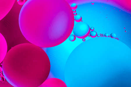 Beautiful color abstract background from mixied water and oil. Pastel colored abstraction. Blue and pink backgroundの写真素材