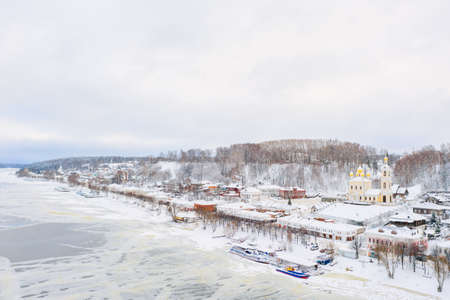 Aerial drone view of ancient russian town Ples on the Volga river in winter with snow, Ivanovo region.の写真素材