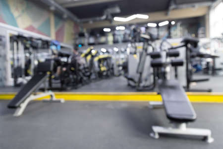Blurred or defocused modern fitness gym. Sports gym or fitness equipment.の写真素材