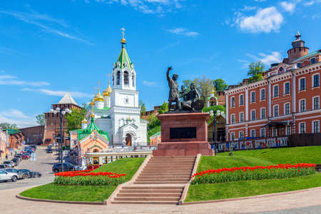 Monument to Minin and Pozharsky with Orthodox church in Nizhny Novgorod, Russia. Summer sunny day.の写真素材