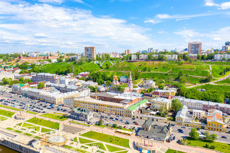 Aerial drone view of Nizhniy Novgorod city center with Volga embankment, Cathedral of the Blessed Virgin Mary Stroganoff church and Kremlin during sunny day, Russia.の写真素材