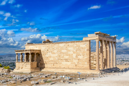 Ancient Erechtheion or Erechtheum temple with Caryatid Porch on the Acropolis, Athens, Greece. World famous landmark at the Acropolis Hillの写真素材