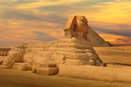 The Great Sphinx and Pyramid against colorful sunset sky in Giza, Cairo, Egypt.の写真素材