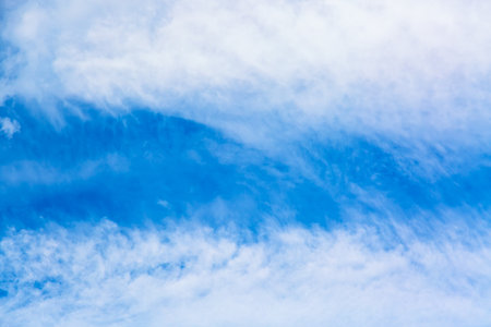 Blue sky background with white clouds. Nature sky background in summer.の写真素材