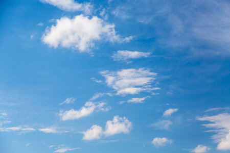 Blue sky background with white clouds. Nature sky background in summer.の写真素材