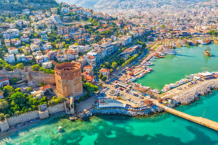 Drone aerial view of Kizil Kule Red tower fortress and Alanya city harbor in Turkey, Asia.の写真素材