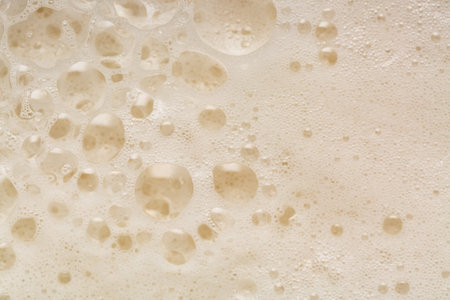 Close up of white foam with bubbles as a background.の写真素材