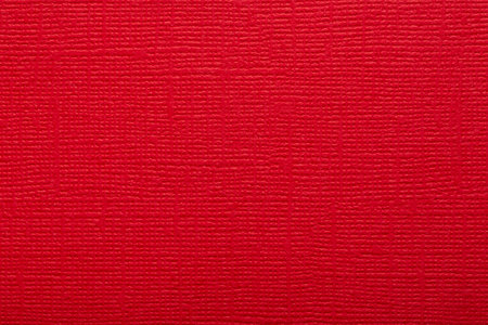 Red paper fabric texture. Red canvas embossed cardboard texture as a background.の写真素材