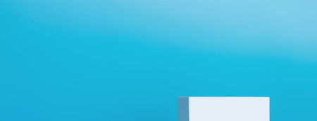 Abstract background template for product display and presentation. Cubic podium or pedestal against blue backgroundの写真素材