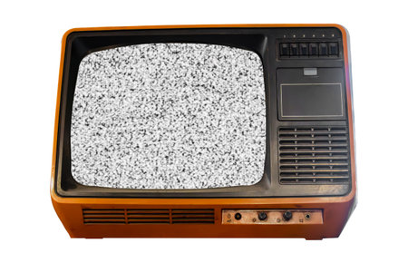 Old vintage orange TV set televisor isolated on white background with no signal television grainy noise effect on the screenの写真素材