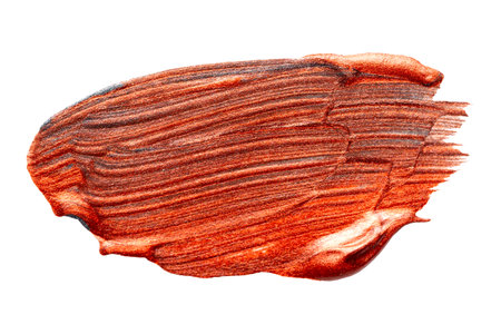 Brown bronze red metallic colored brush stroke isolated on white background. Bronze abstract stroke. Colorful watercolor brush strokeの写真素材