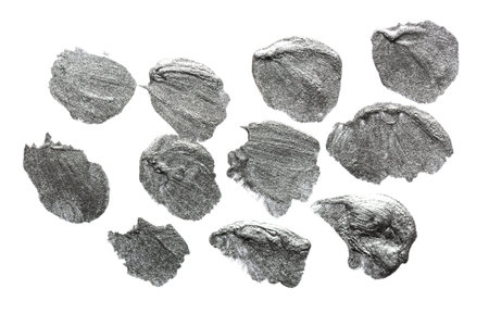Gray silver metallic colored brush strokes and spots isolated on white background. Silver abstract stroke and stains. Colorful watercolor brush strokeの写真素材