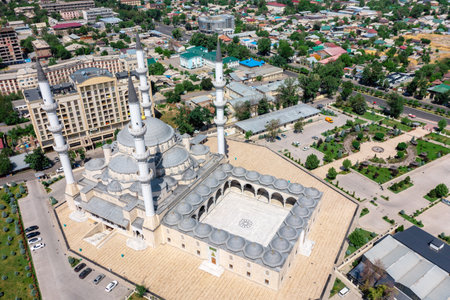 Aerial drone view of the Central Mosque of Imam Sarakhsi on Zhibek Zholu Avenue in the capital city Bishkek, Kyrgyzstan.の写真素材