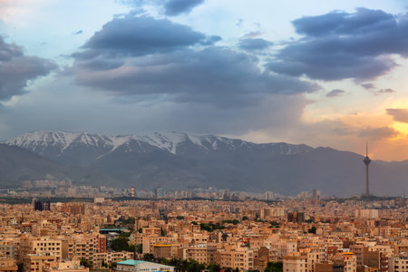 Beautiful cityscape sunset panorama of Tehran city, mountains and Milad tower in during colorful sunset in Iran.の写真素材