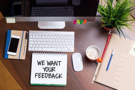 Business Workplace with WE WANT YOUR FEEDBACK Concept