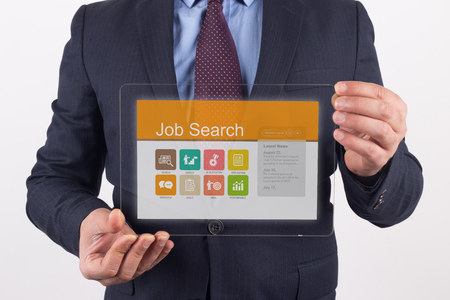 Hand Holding Transparent Tablet PC with Job Search screenの写真素材