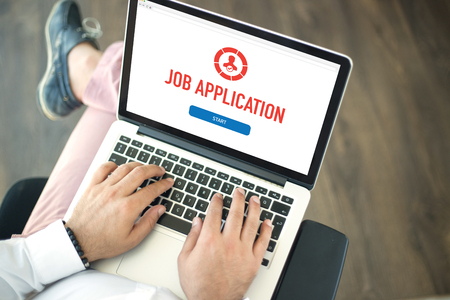 People using laptop and JOB APPLICATION concept on screenの写真素材