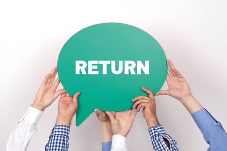Group of people holding the RETURN written speech bubbleの写真素材