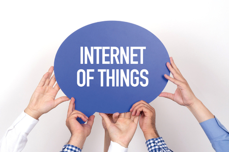 Group of people holding the INTERNET OF THINGS written speech bubbleの写真素材