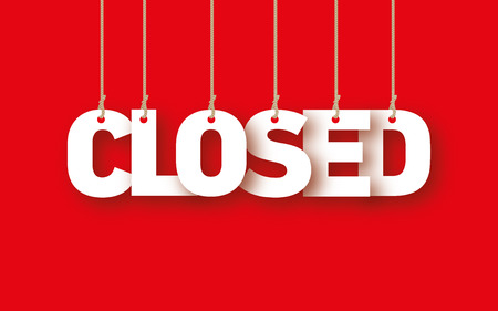 CLOSED the word of the white letters hanging on the ropes on a red backgroundの写真素材