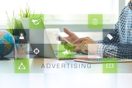 Businessman working in office and Advertising icons conceptの写真素材