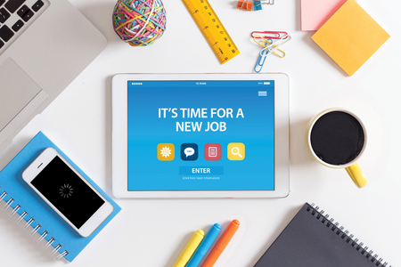 IT'S TIME FOR A NEW JOB CONCEPT ON TABLET PC SCREENの写真素材