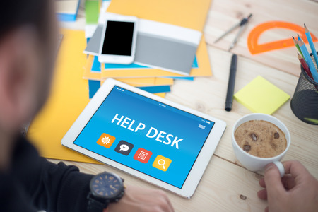 HELP DESK CONCEPT ON TABLET PC SCREENの写真素材