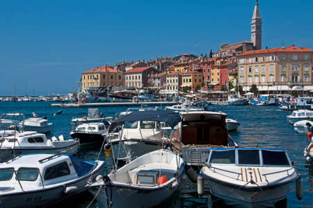 Some boats and the church of Rovinjのeditorial素材