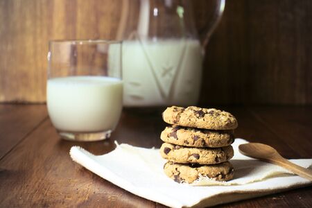 chocolate cookies and a large glass of milk, typical Spanish snack