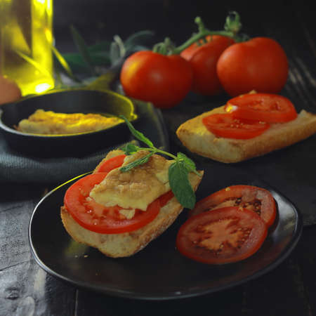French omelette toasts made with olive oil, garnished with natural tomatoの写真素材