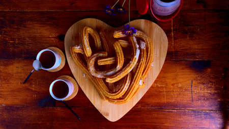 churros with chocolate, typical Spanish breakfast to take as a family on weekendsの写真素材