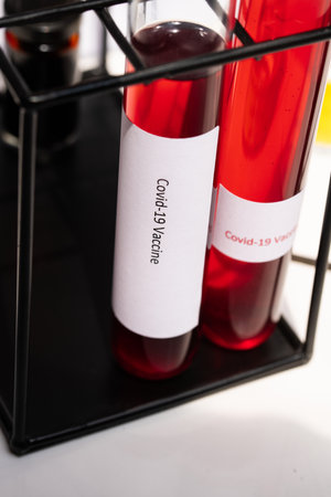 Close-up in a laboratory with test tubes with Covid-19 vaccine.