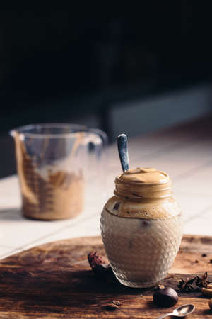 Homemade Dalgona coffee in a mason jar.の写真素材